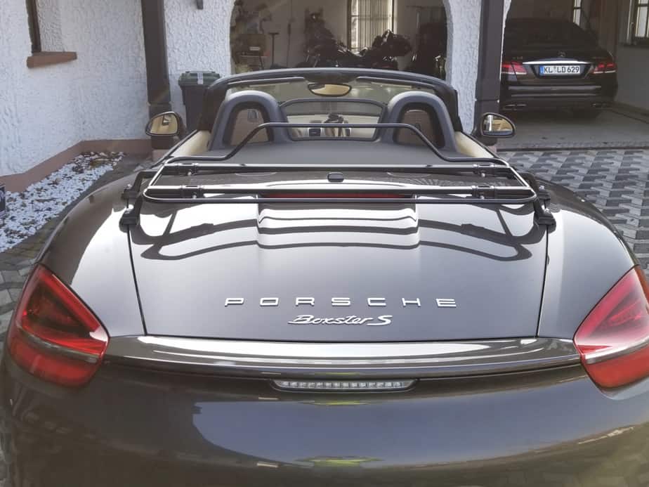 black modern convertible boot rack on a porche 981 boxster with the hod down
