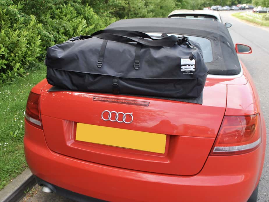 red audi a4 convertible with a boot-bag vacation boot rack fitted