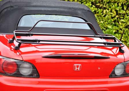 red honda s2000 photographed from the rear with a spring black boot rack fitted