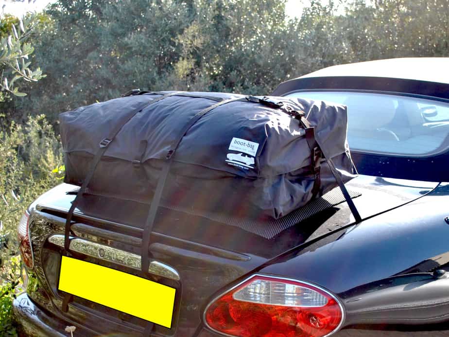 black jaguar xk8 convertible on a sunny day with a boot-bag vacation boot rack fitted