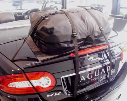 black jaguar xk cabriolet with a boot-bag original boot rack fitted