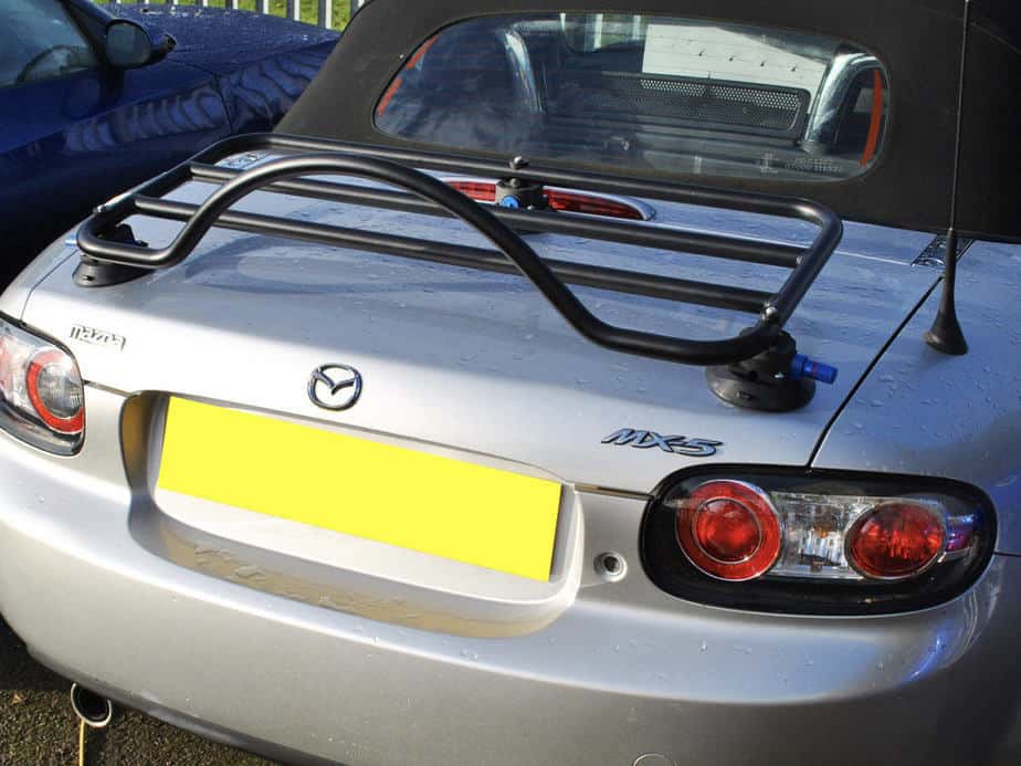 silver mazda mx5 mk3 with a black revo-rack boot rack fitted on a sunny day