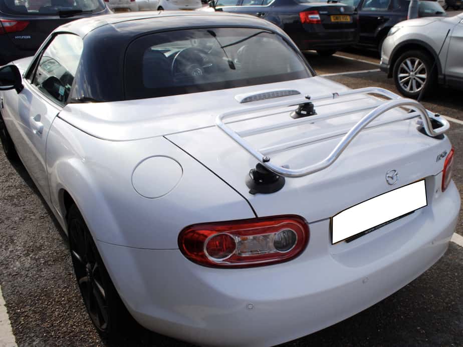 white mazda mx5 mk3 roadster coupe with a revo-rack boot rack fitted