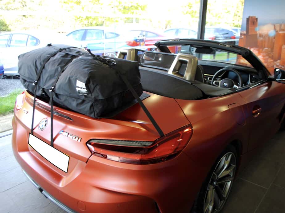 bronze bmw z4 g29 with the hood down and a boot-bag vacation boot rack fitted