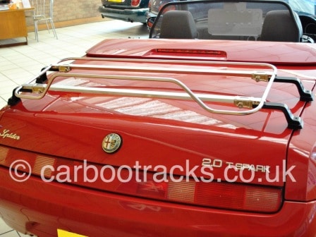 red alfa romeo spider 916 with a stainless steel boot rack fitted