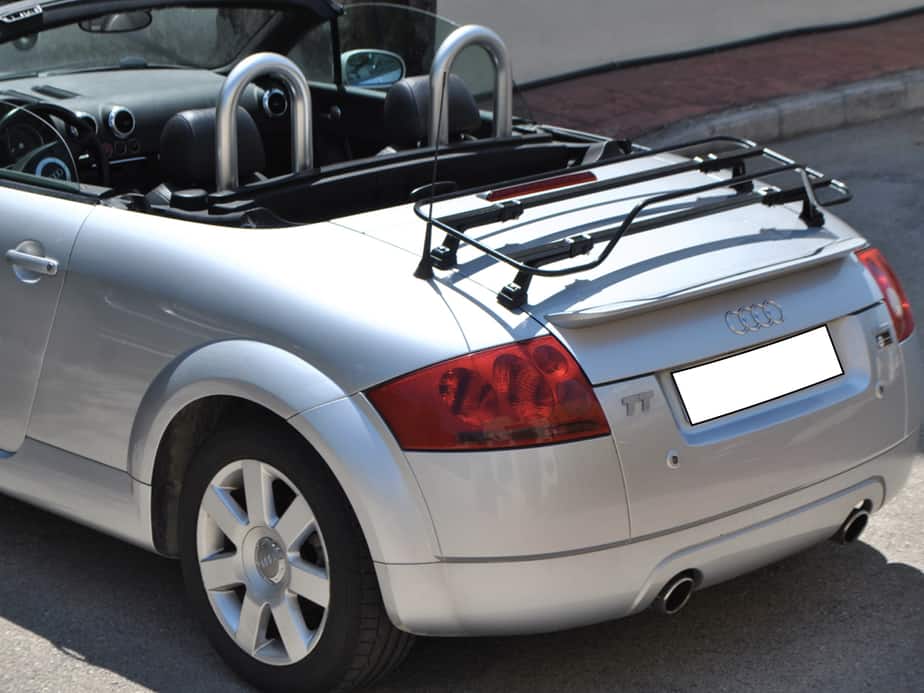 silver mk1 audi tt roadster with the hood down on a sunny day and a black boot rack fitted