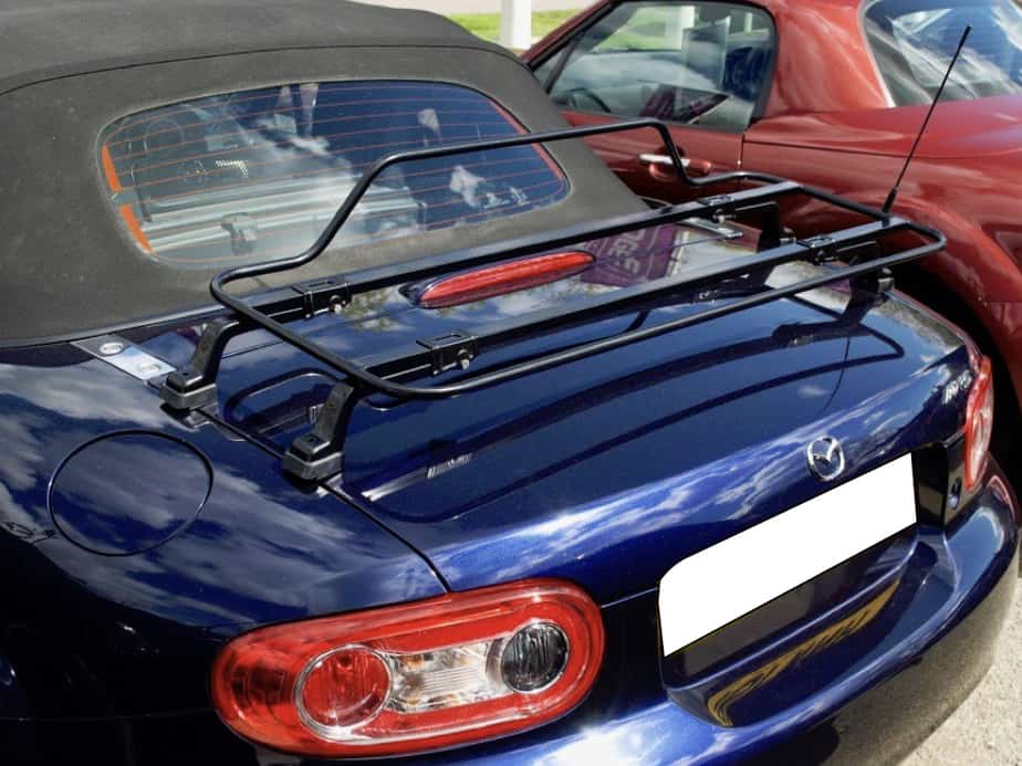 dark blue mazda mx5 mk3 fabric roof with a black boot rack fitted