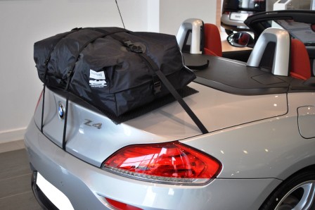 silver bmw z4 e89 folding had top with the roof down and a boot-bag vacation boot rack fitted