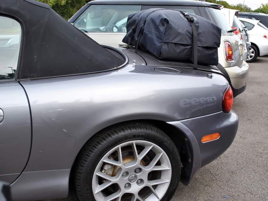 grey mazda mx5 mk2 photographed from the side with a boot-bag vacation boot rack fitted 