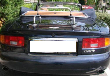 blue aston martin db7 convertible with a classic wood boot rack fitted