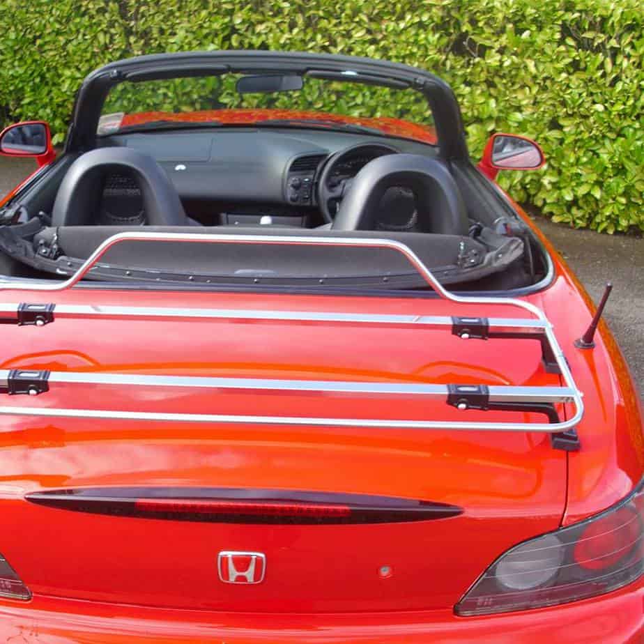 red honda s2000 with the hood down and a stainless steel boot rack fitted