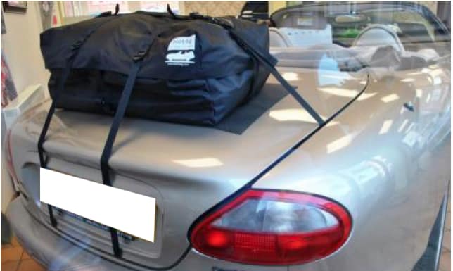silver jaguar xk8 convertible with the hood down and a boot bag boot rack fitted