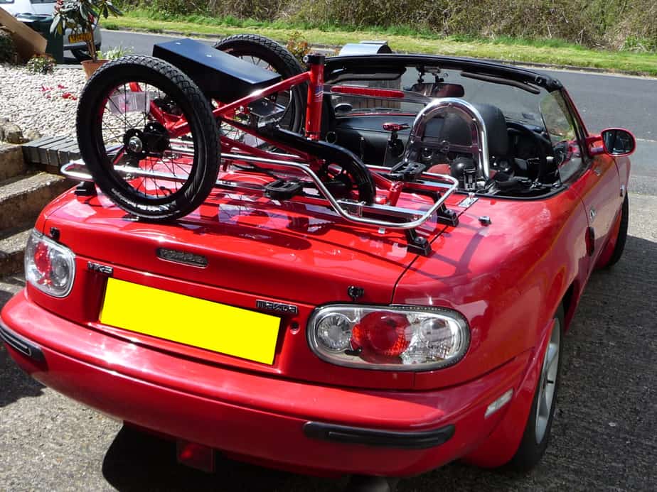 Red mx5 mk1 boot rack in stainless steel carrying a trike