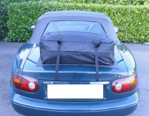 green mazda mx5 mk1 with a boot-bag boot rack fitted