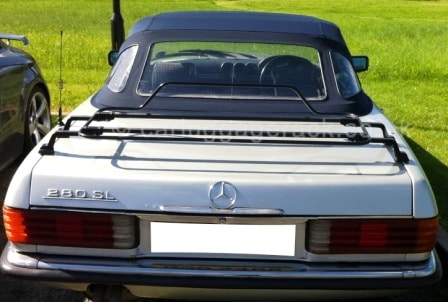 silver mercedes benz sl r107 with a black boot rack fitted