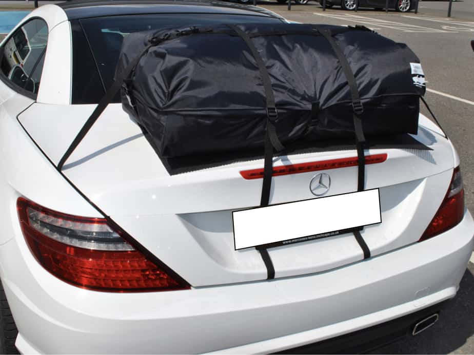 white mercedes benz slk 250 with a boot-bag vacation luggage rack fitted