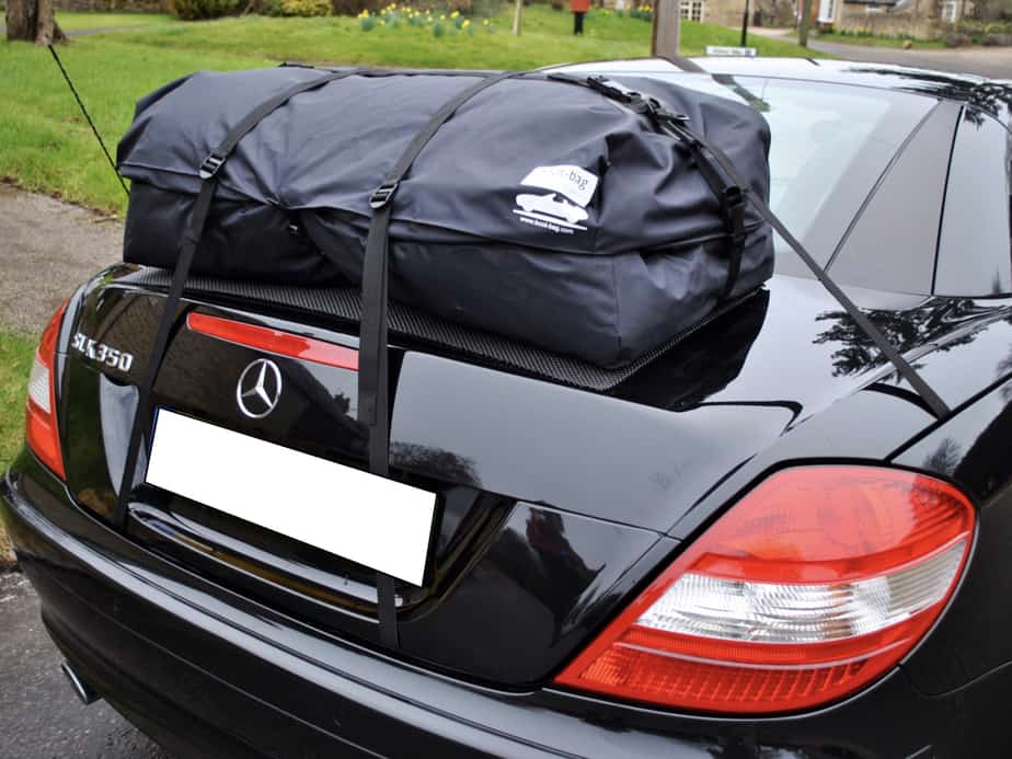 black mercedes-benz slk 350 with a boot-bag vacation luggage rack fitted