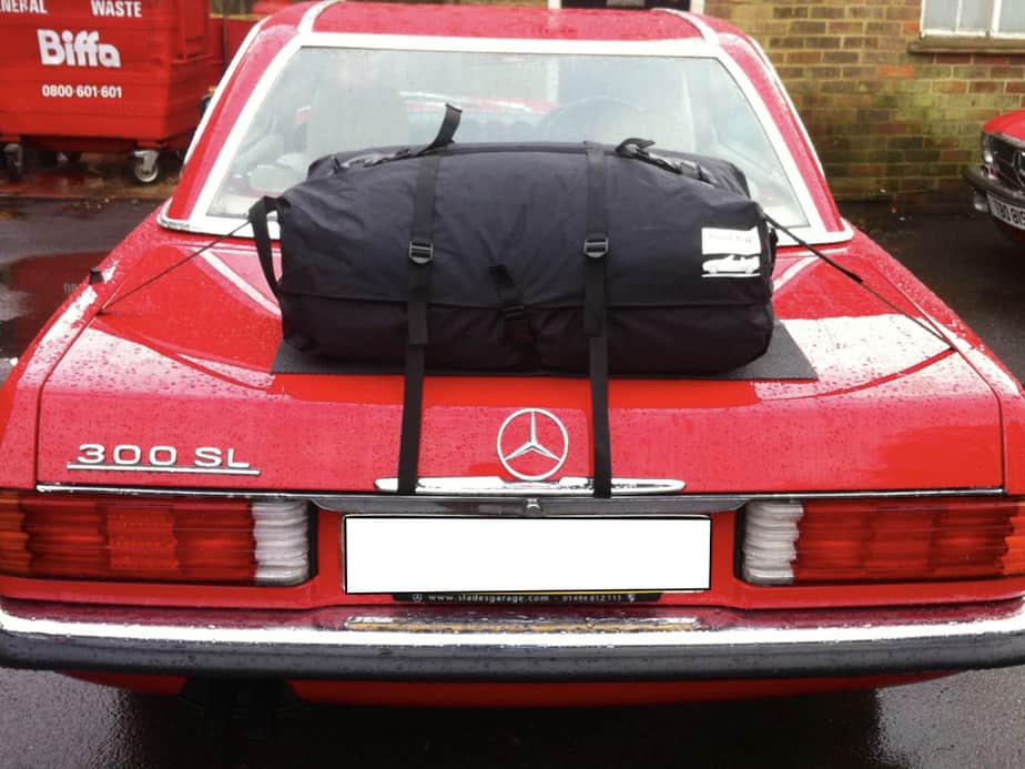 red mercedes sl r107 with a rd hardtop fitted and a boot-bag original on the boot lid