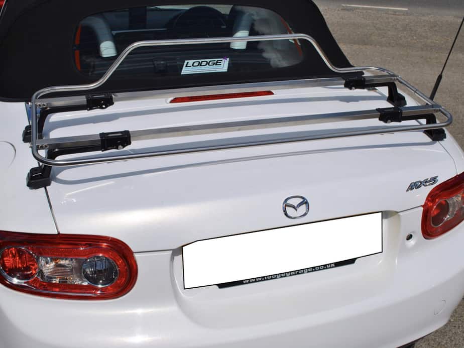 white mazda mx5 mk3 fabric roof model with a stainless steel boot rack fitted