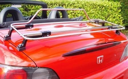 close up of a Honda S2000 with a stainless steel luggage rack fitted