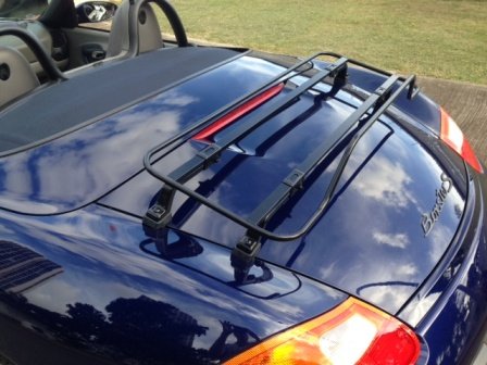 dark blue 986 porsche boxster with a black boot rack fitted