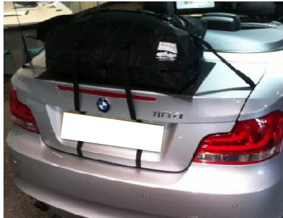 silver bmw 1 series convertible in a bmw showroom with a boot-bag boot rack fitted