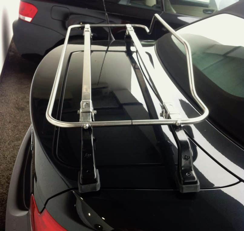 black bmw 1 series convertible with a stainless steel boot rack fitted photographed from the side