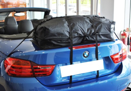blue bmw 4 series convertible with a boot-bag vacation boot rack fitted