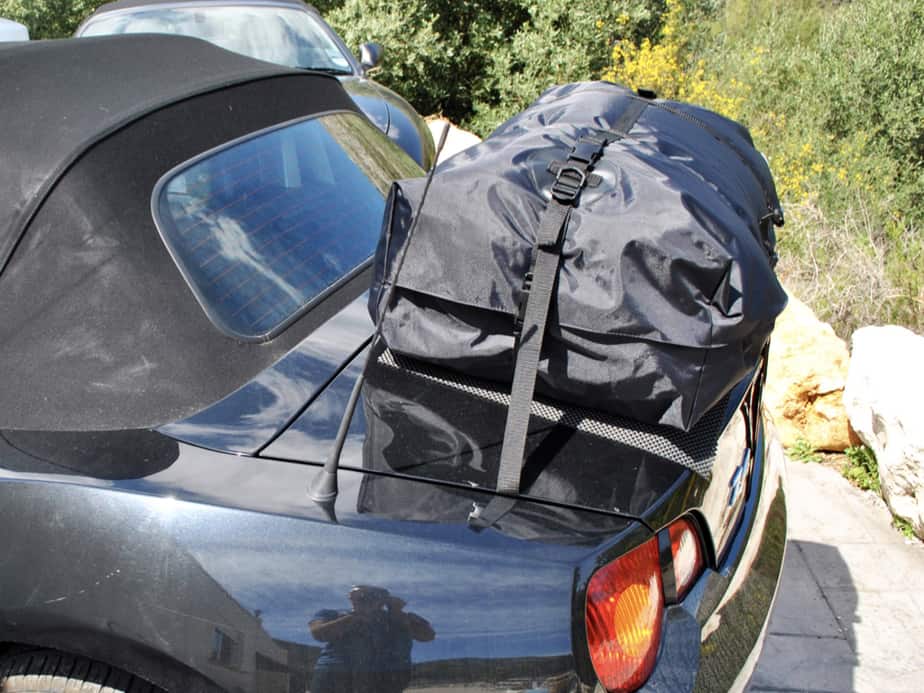 side view of a boot-bag vacation boot rack fitted to a black z4 e85 on a sunny day