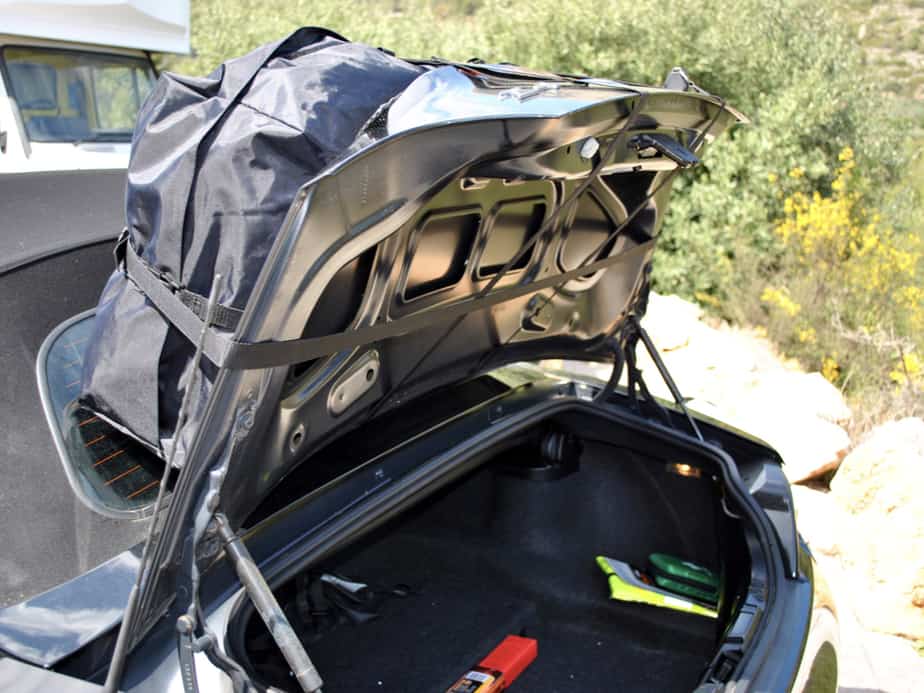 side view of a black bmw z4 e85 with the boot open showing how the boot-bag vacation boot rack attaches.