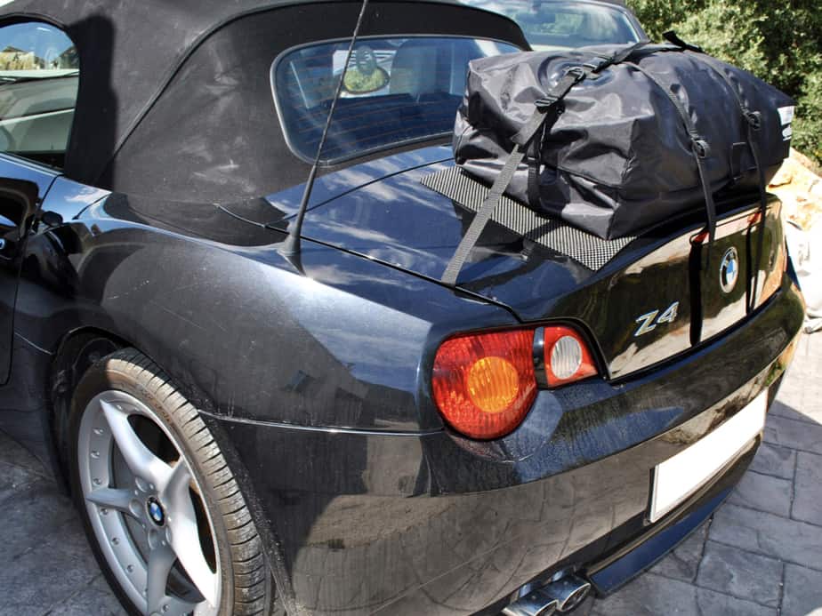 black bmw z4 e85 with a boot-bag original boot rack fitted photographed from the rear on a sunny day.