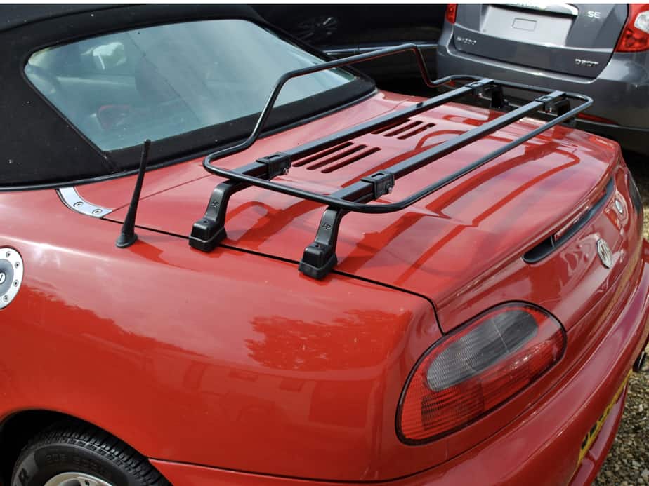 red mgf with a black boot rack fitted photographed from the side