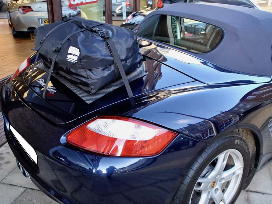 side view of a porsche boxster in blue with a boot-bag boot rack fitted