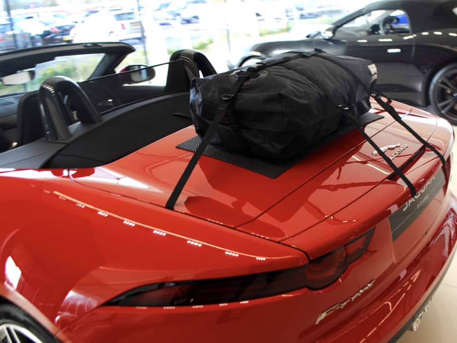 side view of a boot-bag original boot rack fitted to a red jaguar f type convertible