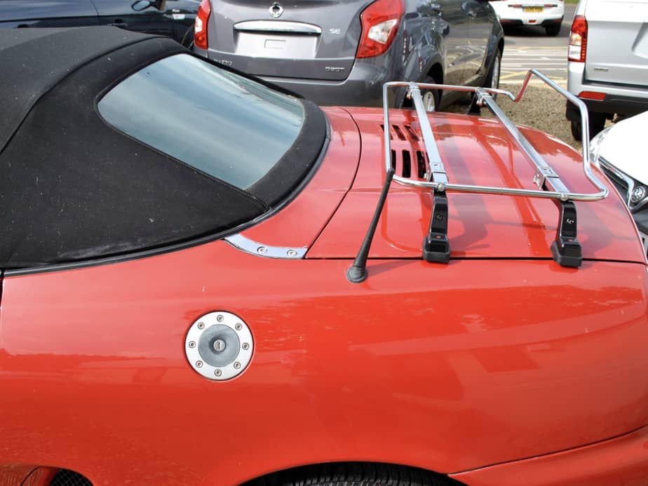 side view of a red mgtf with a stainless steel boot rack fitted