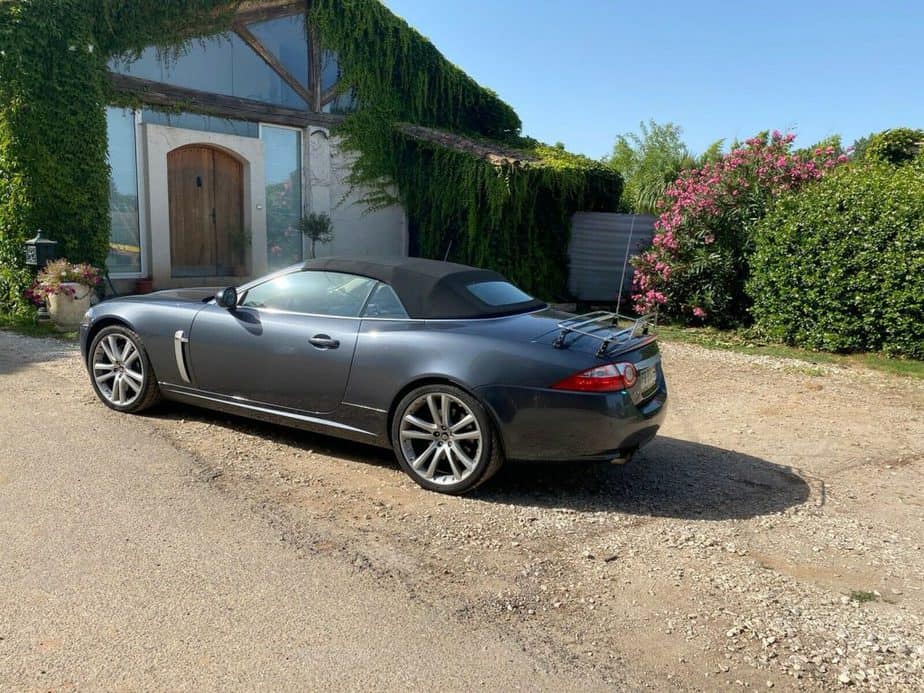 grey jaguar xk cabriolet with a stainless steel boot rack fitted