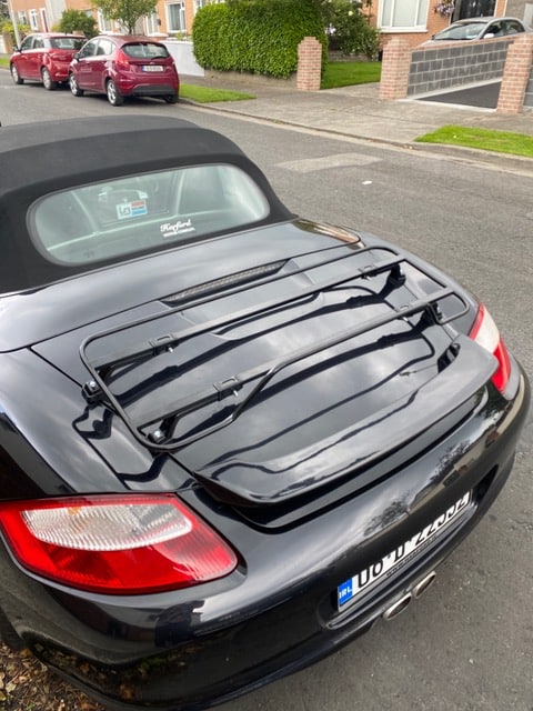 black porsche boxster 987 with a black luggage rack fitted
