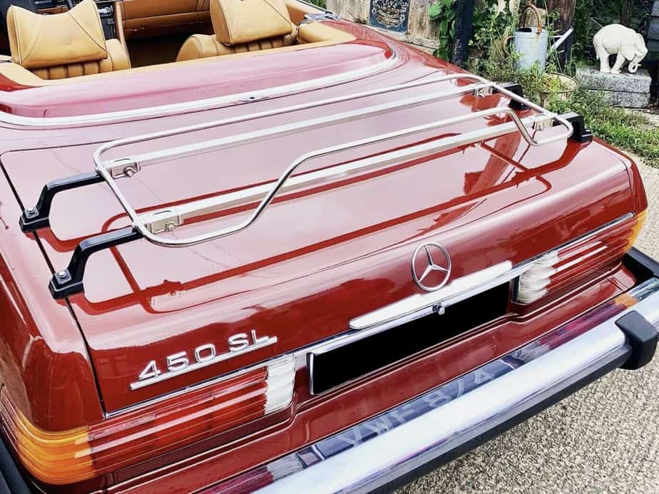 burgandy mercedes sl r107 450 with a stainless steel boot rack fitted