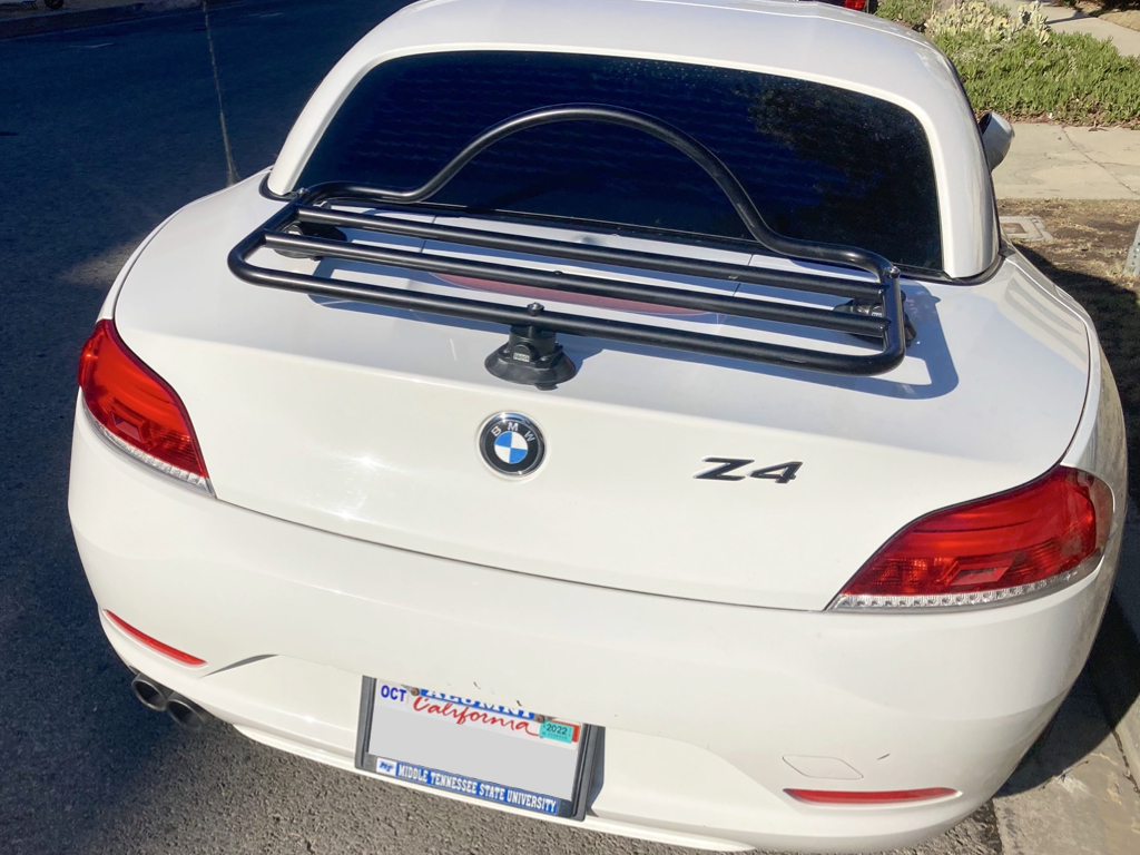 white bmw z4 e89 with a black luggage rack fitted photographed close from the rear