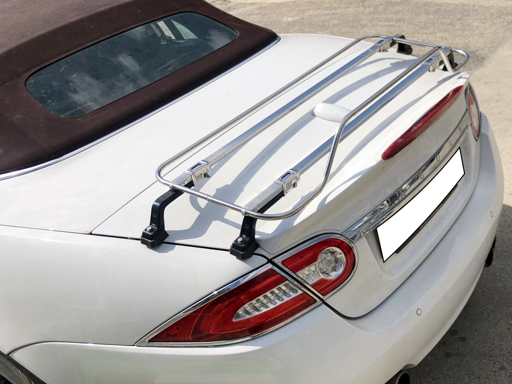 rear view of a white Jaguar xk convertible with a stainless steel boot rack fitted 