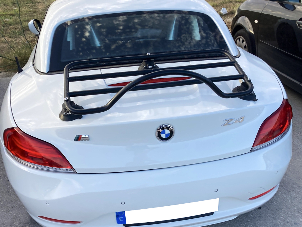 white bmw z4 e89 with a revo-rack black luggage rack fitted to it photographed close from the rear 