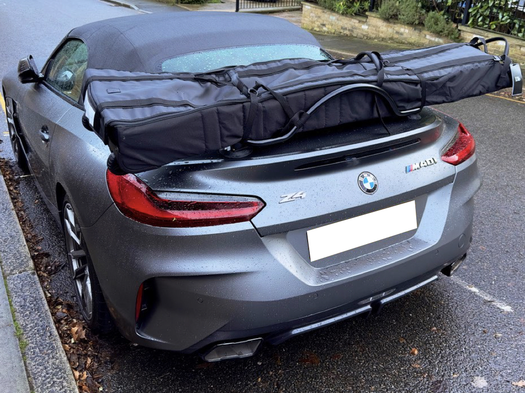 grey blw z4 m40i g29 with a luggage rack fitted carrying a set of skis in a black bag